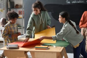 Children making craft work in team